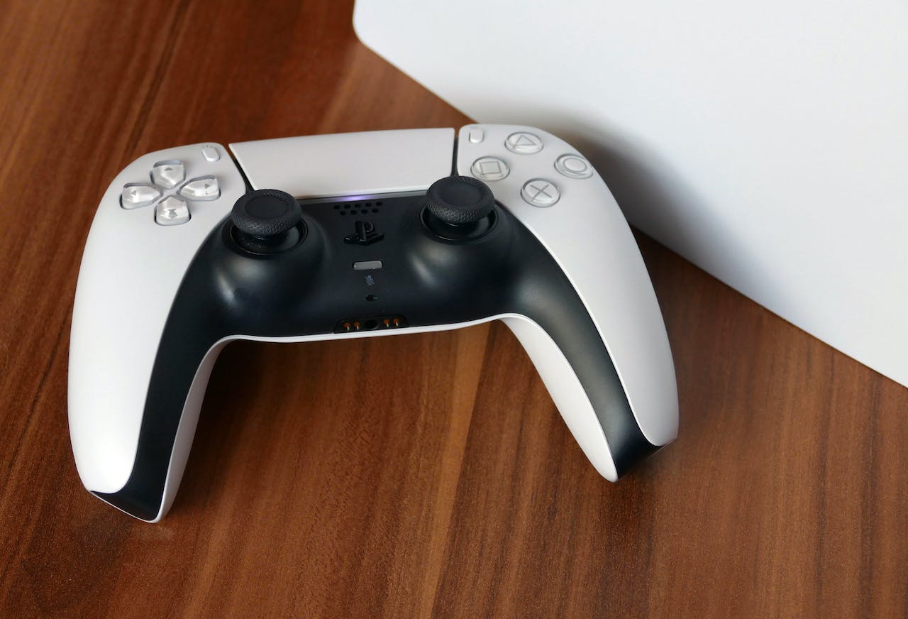 A White Controller Sitting on Top of a White Box