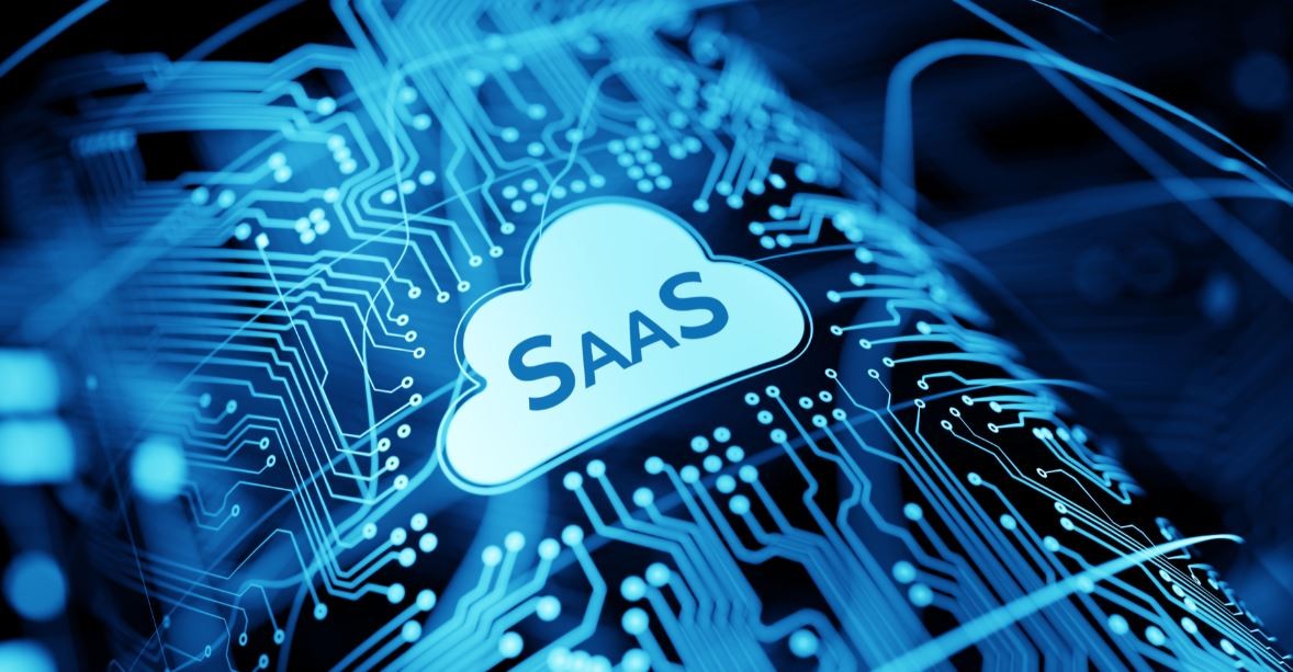 Cloud with SaaS text over a digital circuit background.