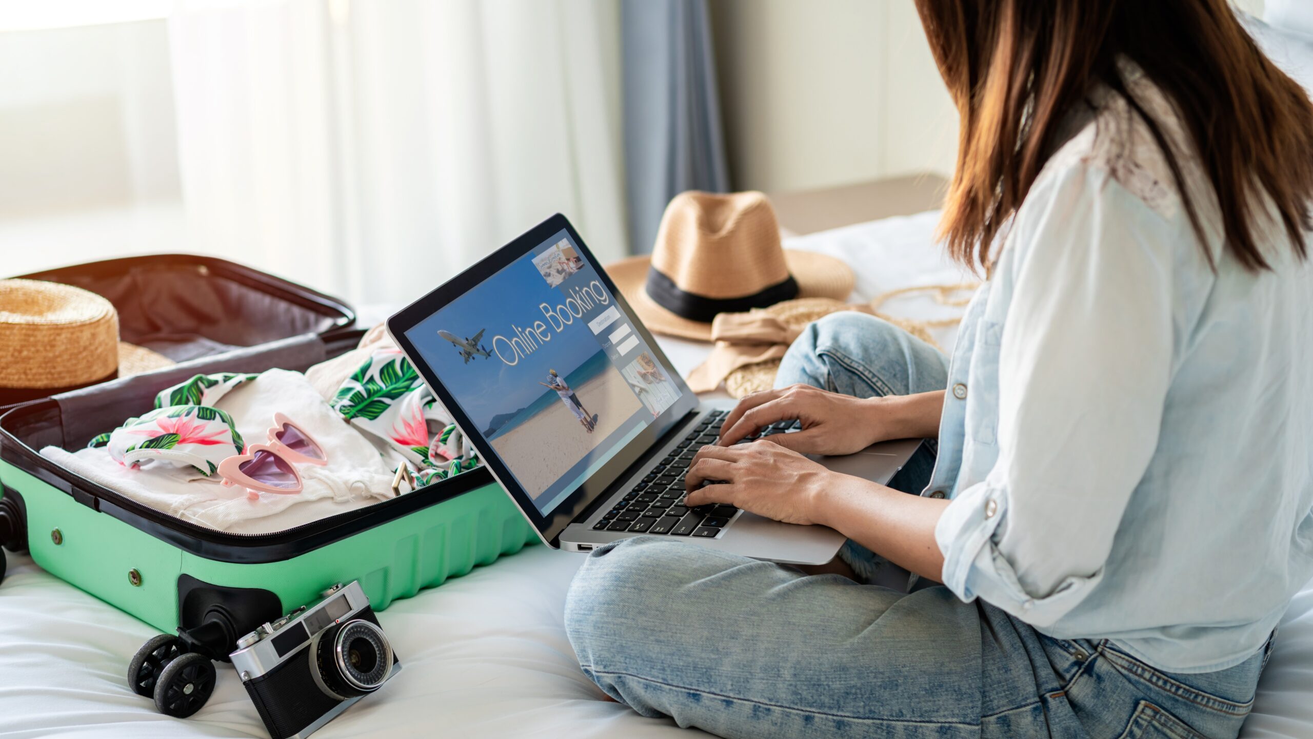 Woman booking a reservation on her laptop